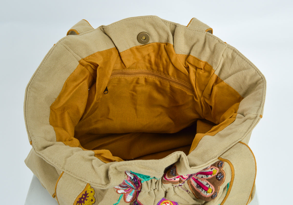 Beautiful casement bag colourfully decorated with embroidery and applique